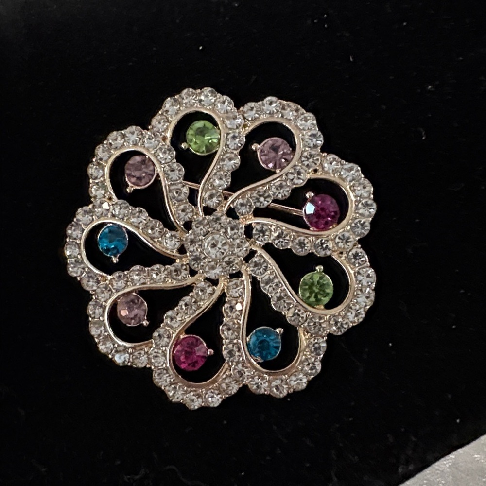Gorgeous Monet brooch with multi color stones.